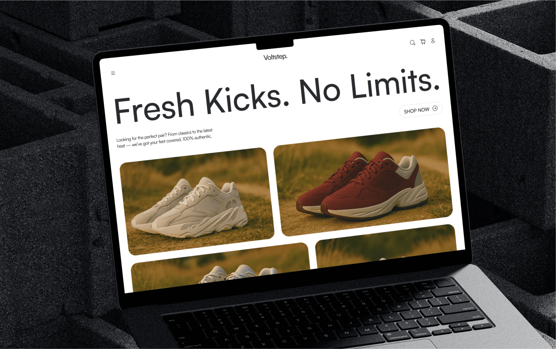 A laptop displaying an online sneaker store website
