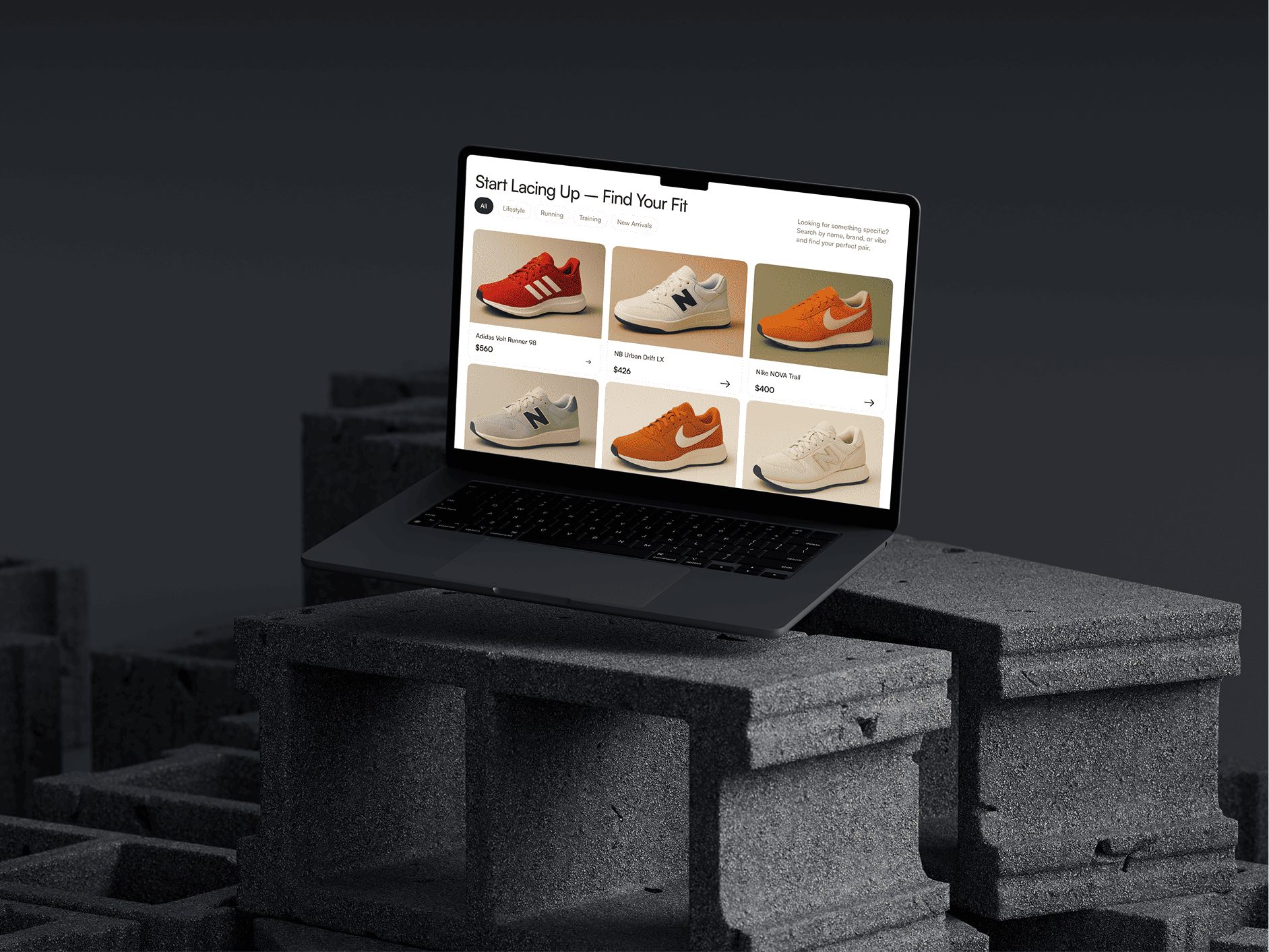 A laptop displaying a sneaker e-commerce website on its screen, showing a selection of shoes from brands like Adidas, New Balance, and Nike