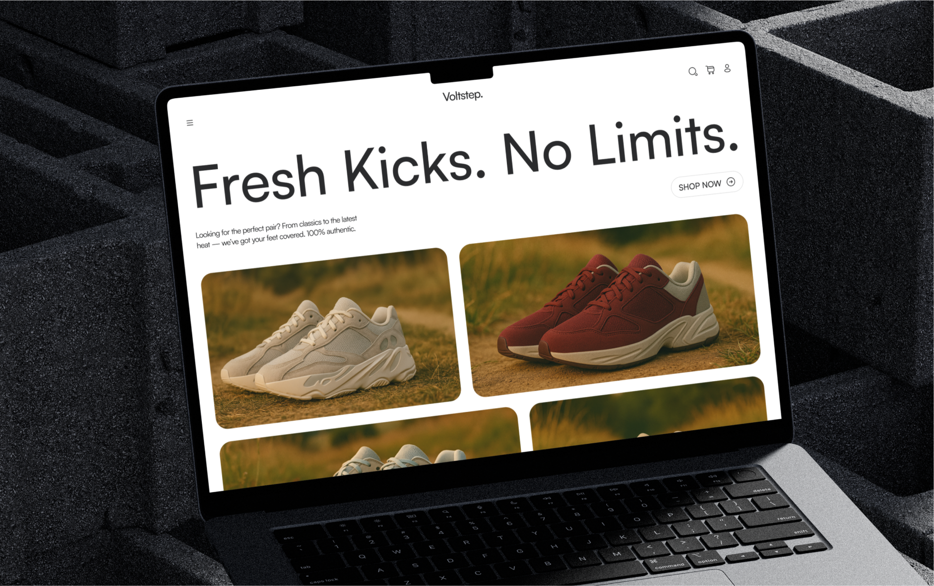 A laptop displaying an online sneaker store website
